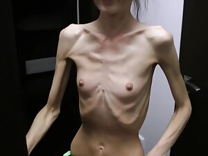 Half-starved Denisa posing lay away up up has ribs diseased